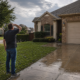 DFW homeowner inspecting residential roof after a hail storm