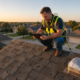 A Grade Roofing inspector documenting hail damage on a DFW residential roof